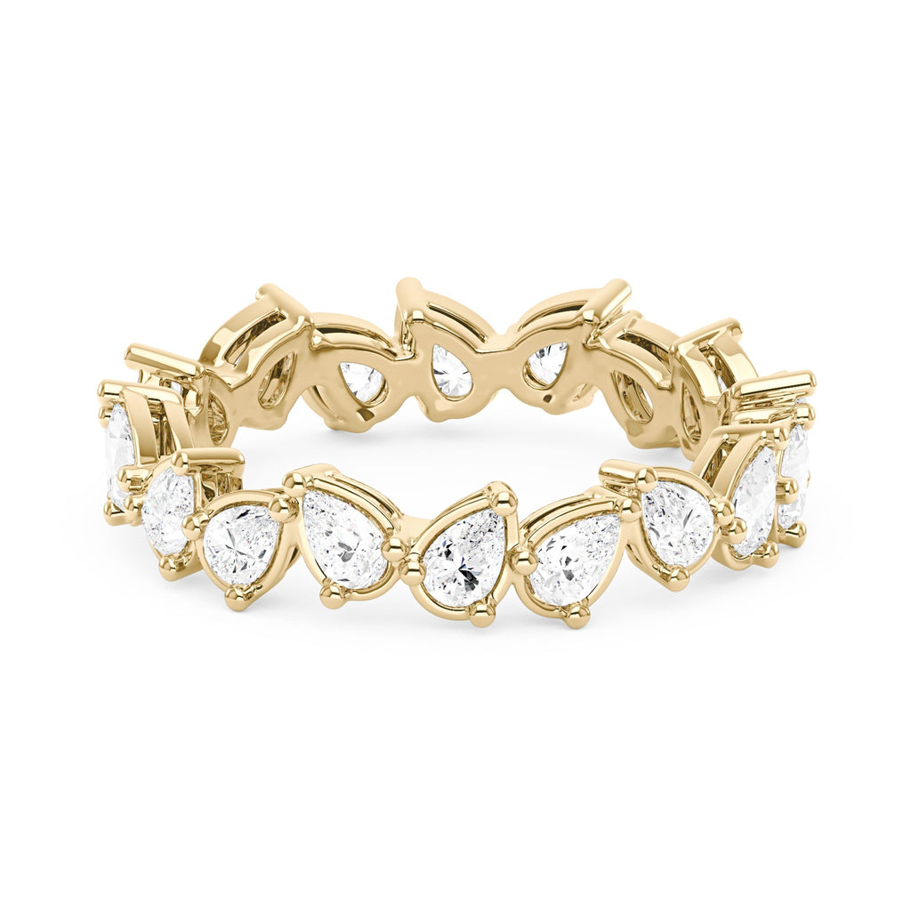 Alliance sertie d'une moissanite poire irrégulière